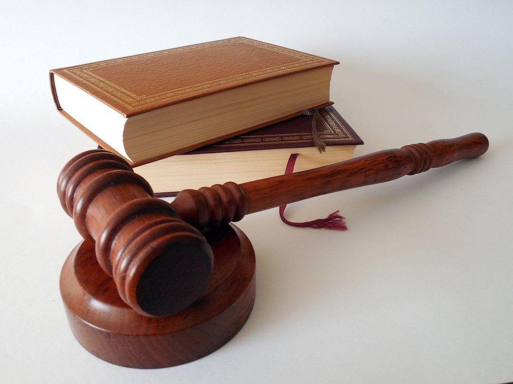 gavel on table next to books